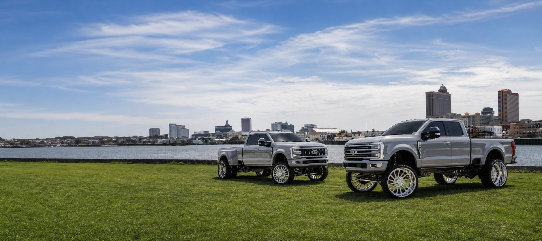Two lifted Elevate Super Duty trucks